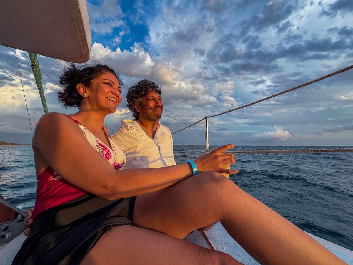 Riz and Reem sitting on a catamaran in the Pacific Ocean as part of a sunset Catamaran cruise based out of Tamarindo, Costa Rica.