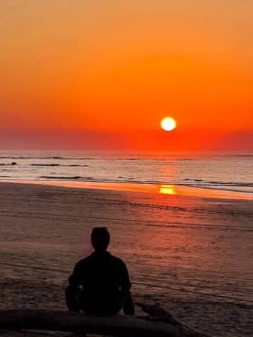 Riz sitting watching the Tamarindo sunset by himself.