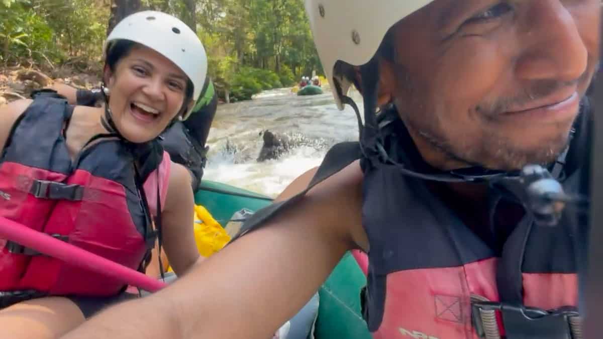 Reem and Riz smiling as they traverse white water rapids on the Tenorio river, a few hours outside of Tamarindo, Costa Rica.