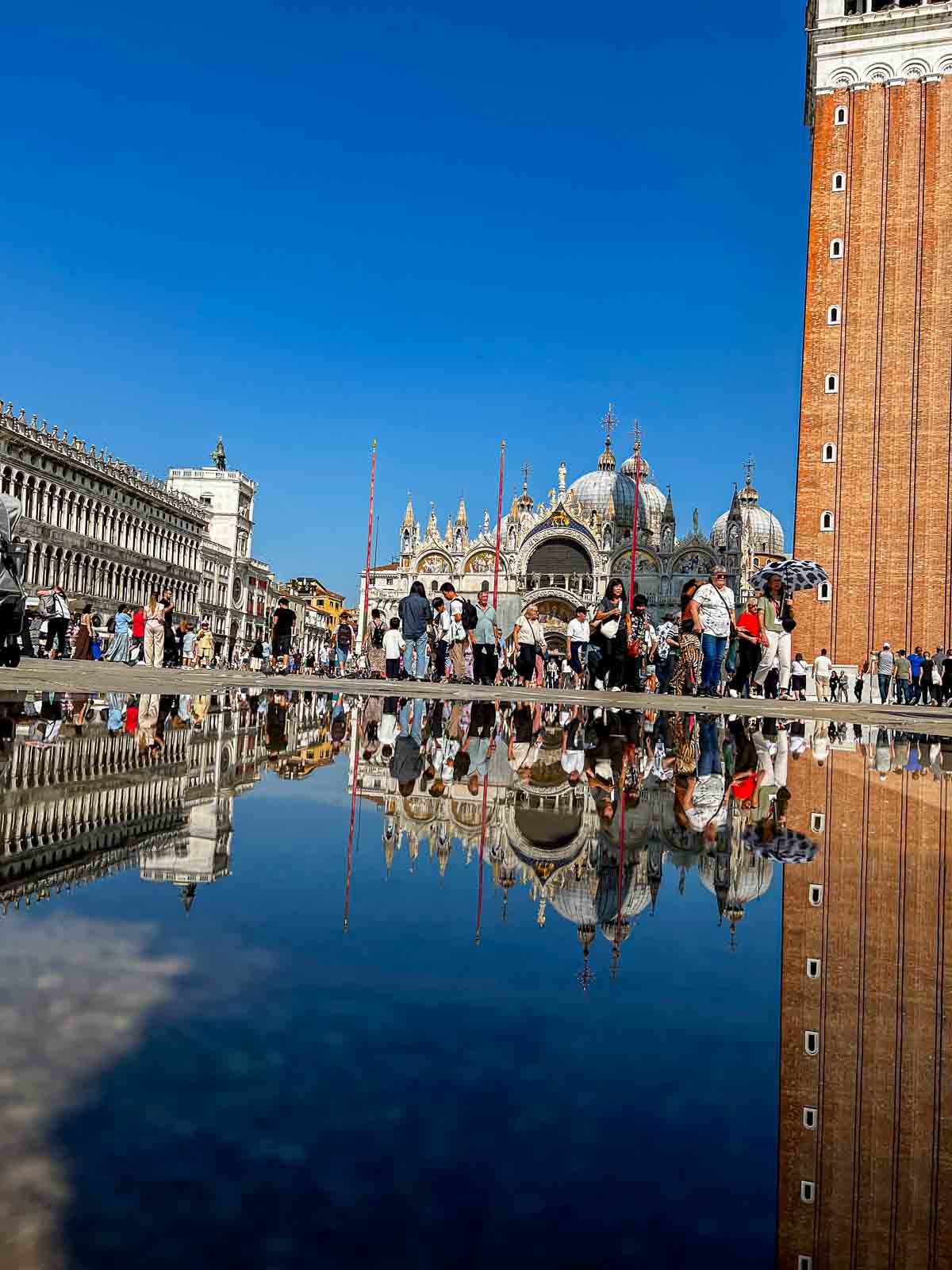 St. Mark's Basilica and Campanile reflected in floodwater in Piazza San Marco