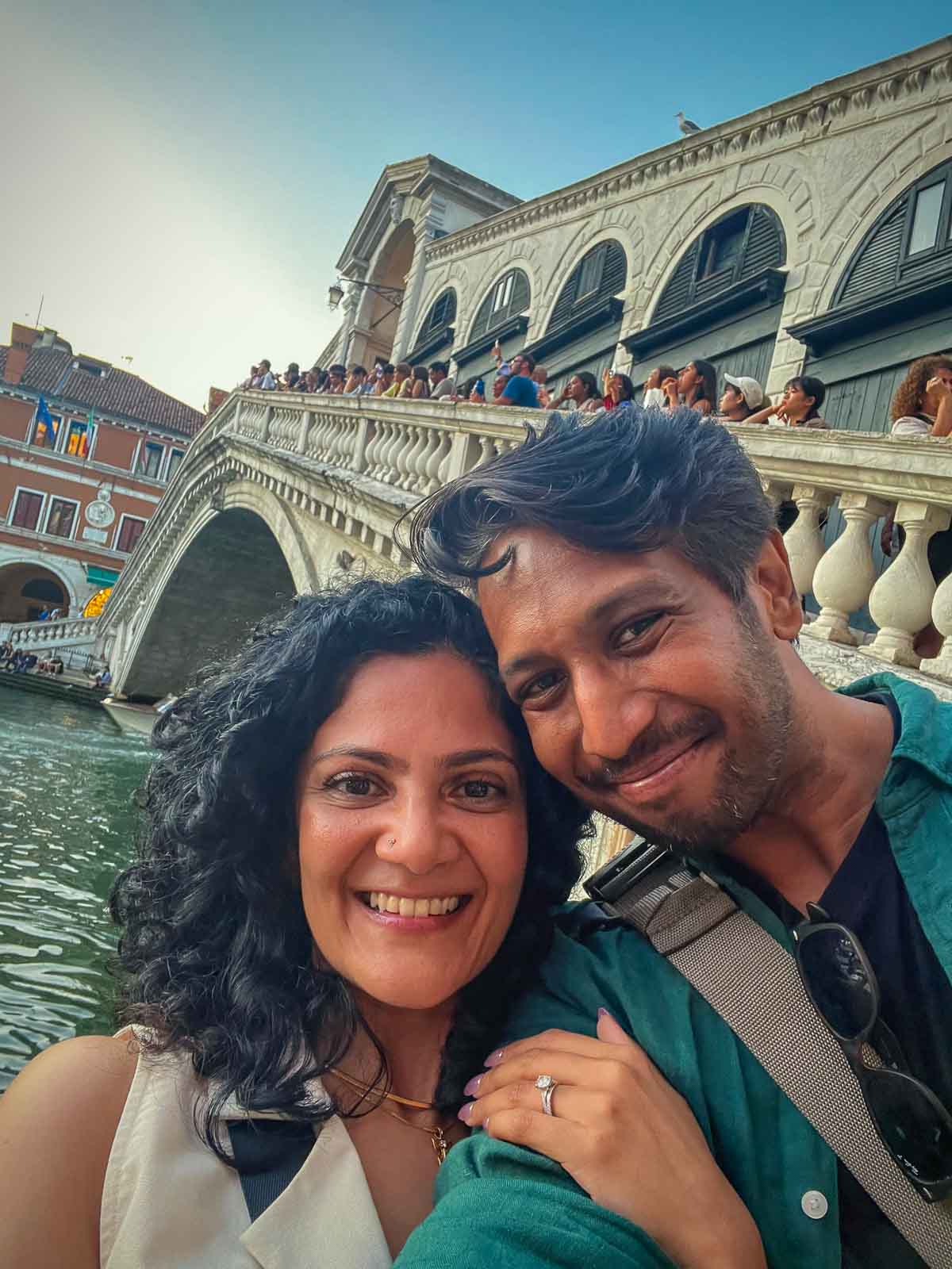Riz and Reem at the Rialto Bridge overlooking the Grand Canal in Venice