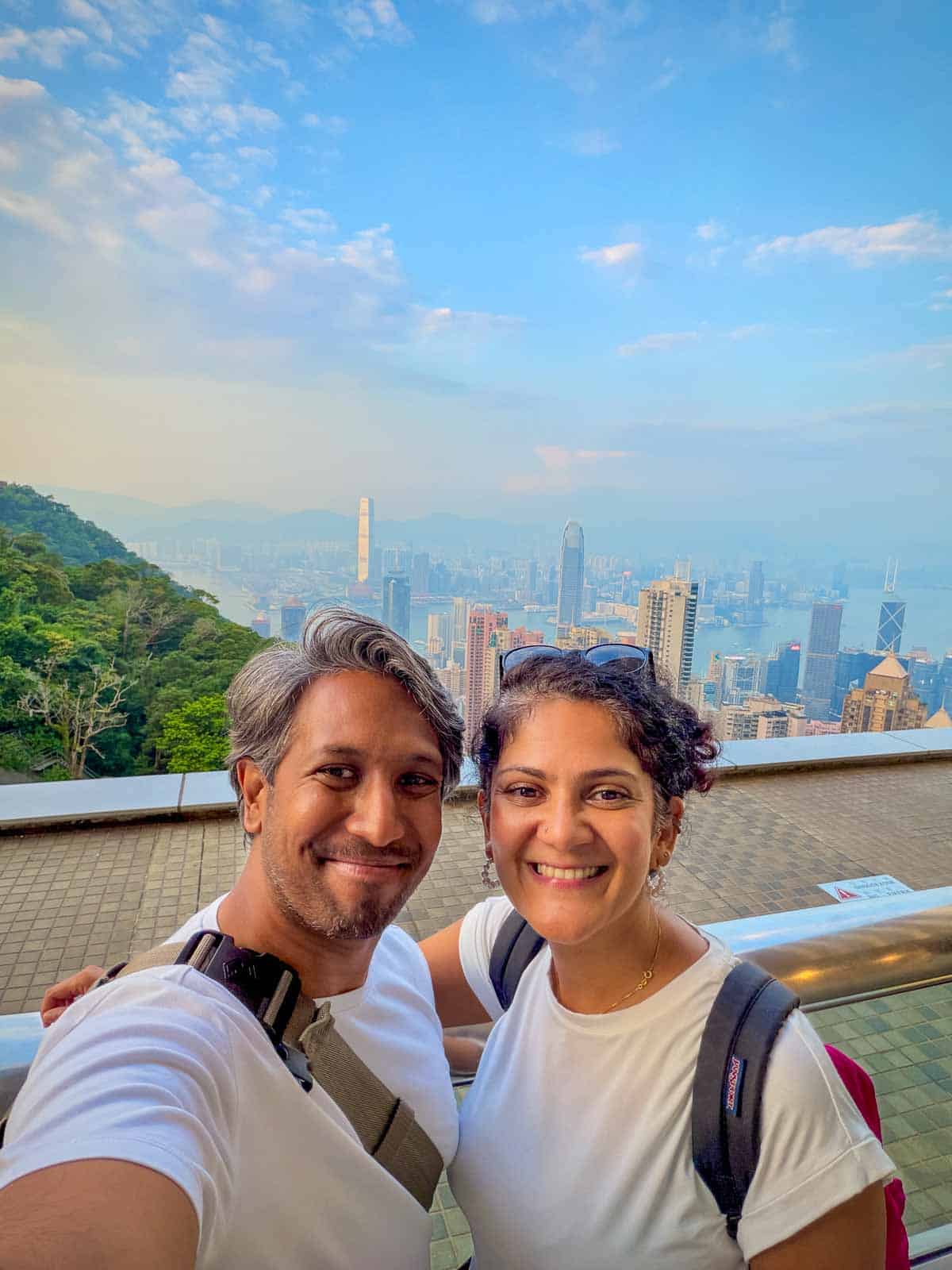 Riz and Reem at Victoria Peak overlooking Hong Kong’s skyscrapers, Victoria Harbour and Kowloon.