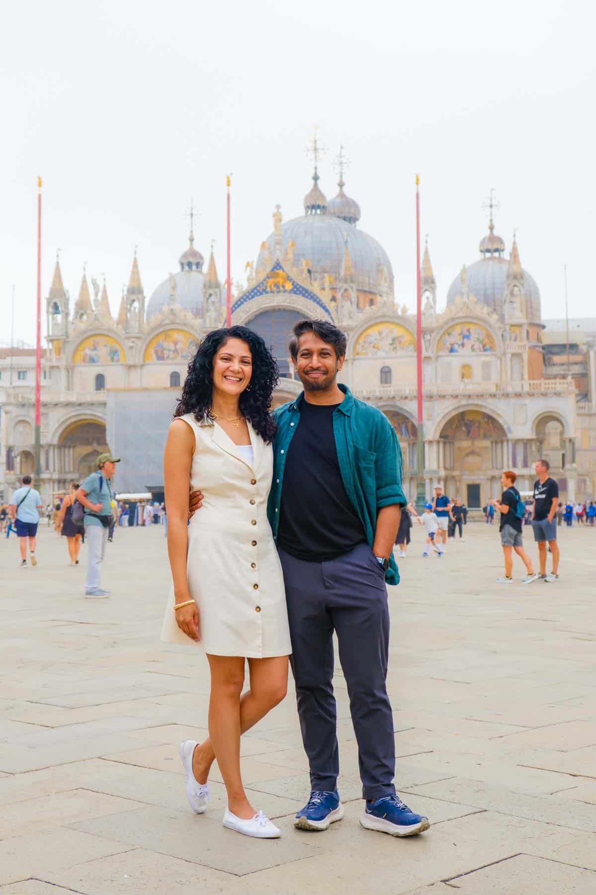 Riz and Reem in St. Mark's Square with St. Mark's Basilica in the background