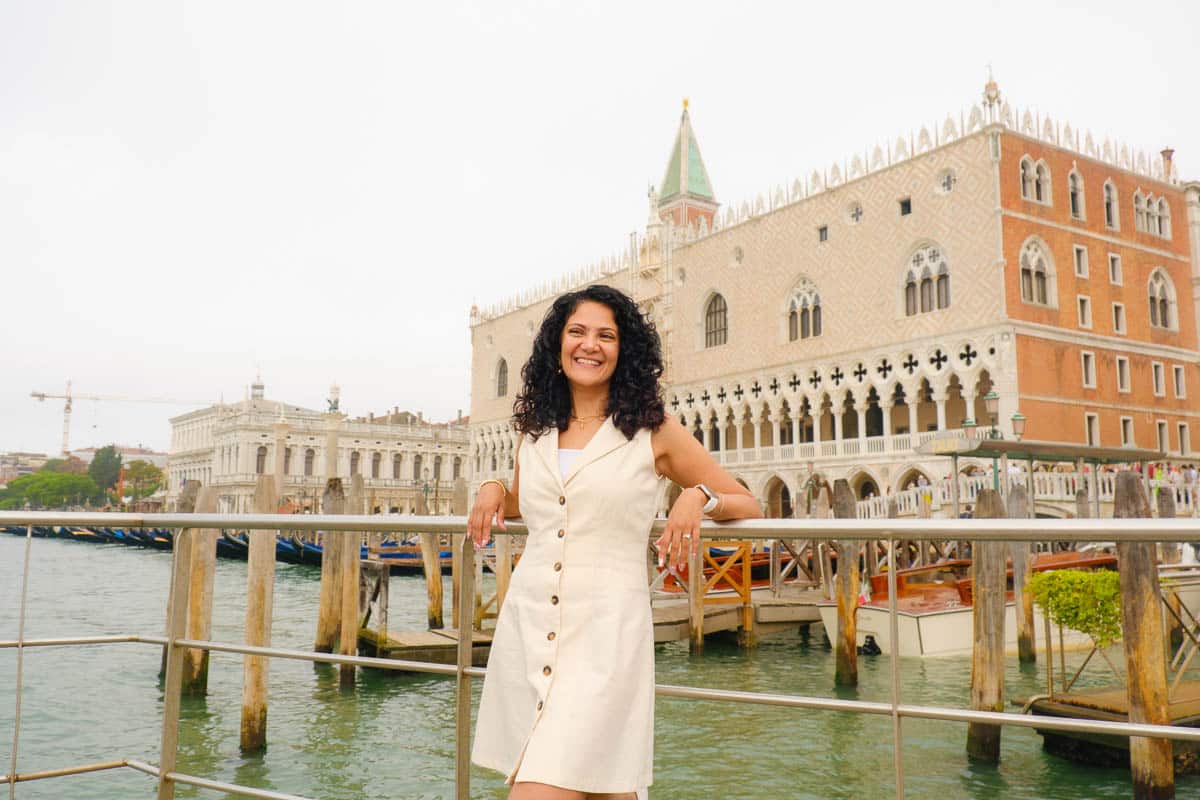 Reem standing by the waterfront in front of the Doge's Palace in Venice.